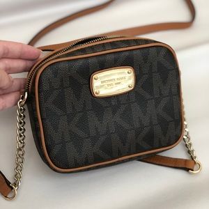 Michael Kors brown leather cross body purse.